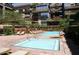 Inviting pool area with hot tub and lounge chairs, perfect for relaxation and sunbathing at 7121 E Rancho Vista Dr # 1008, Scottsdale, AZ 85251