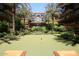 Scenic putting green framed by lush landscaping and palm trees, inviting outdoor recreation at 7121 E Rancho Vista Dr # 1008, Scottsdale, AZ 85251