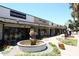 Shopping center featuring curated storefronts and decorative landscaping at 7121 E Rancho Vista Dr # 1008, Scottsdale, AZ 85251