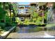 Beautiful water feature surrounded by lush greenery and palm trees, offering a tranquil retreat at 7121 E Rancho Vista Dr # 1008, Scottsdale, AZ 85251
