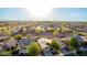 Aerial view of a home in a neighborhood with desert landscaping and desert views at 7336 S 253Rd Ave, Buckeye, AZ 85326