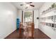 Cozy dining room featuring a wooden table, open windows, and shelves full of books at 7336 S 253Rd Ave, Buckeye, AZ 85326