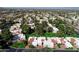 Aerial view of a community featuring single Gathering homes with well-maintained lawns and mature trees at 7350 E Arlington Rd, Scottsdale, AZ 85250