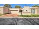 Charming home featuring a two-car garage, a well manicured lawn, and a welcoming front entryway at 7350 E Arlington Rd, Scottsdale, AZ 85250