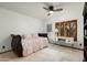 Charming bedroom with a decorative daybed, ceiling fan, and built-in storage at 8325 N 73Rd Pl, Scottsdale, AZ 85258