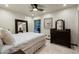 Cozy bedroom featuring a comfortable bed and dark wood furnishings at 8325 N 73Rd Pl, Scottsdale, AZ 85258