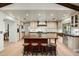 Large eat-in kitchen with island, modern appliances, custom cabinets and beams at 8325 N 73Rd Pl, Scottsdale, AZ 85258