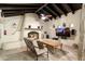 Charming living area with a fireplace, wood beams, and cozy seating arrangement at 8325 N 73Rd Pl, Scottsdale, AZ 85258