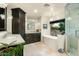 Luxurious main bathroom with freestanding tub, glass shower and cabinetry at 8325 N 73Rd Pl, Scottsdale, AZ 85258