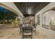 Spacious outdoor patio featuring an outdoor dining area and outdoor fireplace, perfect for entertaining at 8325 N 73Rd Pl, Scottsdale, AZ 85258
