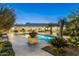 Beautiful backyard pool area with mature landscaping, an outdoor kitchen and large pool at 8325 N 73Rd Pl, Scottsdale, AZ 85258