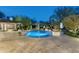 Inviting pool area with a gazebo, lush landscaping, and elegant lighting at 8325 N 73Rd Pl, Scottsdale, AZ 85258