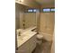 Bathroom features a shower over bath and a sink with a vanity unit at 8929 E Bramble Ave, Mesa, AZ 85208