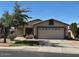Charming single-story home featuring a well-maintained front yard, a two-car garage and a cozy, inviting curb appeal at 8929 E Bramble Ave, Mesa, AZ 85208