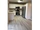 The kitchen features white cabinets and stainless steel appliances at 8929 E Bramble Ave, Mesa, AZ 85208
