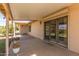 Covered back patio featuring a concrete floor and sliding glass doors to the interior at 9022 N 39Th Ave, Phoenix, AZ 85051