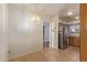 Lovely dining area adjacent to kitchen with stainless steel refrigerator and stylish chandelier at 9022 N 39Th Ave, Phoenix, AZ 85051