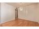 An inviting dining space with hardwood floors, modern lighting fixture, and bright natural light at 9022 N 39Th Ave, Phoenix, AZ 85051