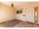 Covered front porch with security door, window, and welcome mat at 9022 N 39Th Ave, Phoenix, AZ 85051