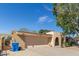 Attached garage with brick accents and covered front entry at 9022 N 39Th Ave, Phoenix, AZ 85051