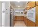 Classic kitchen with modern appliances, wooden cabinets, and bright natural light at 9022 N 39Th Ave, Phoenix, AZ 85051