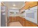 Classic kitchen with modern appliances, wooden cabinets, and bright natural light at 9022 N 39Th Ave, Phoenix, AZ 85051