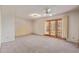 Spacious living room with carpet flooring and glass doors leading to the outside at 9022 N 39Th Ave, Phoenix, AZ 85051