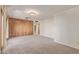 Living room with wood paneling, carpet flooring, and ceiling fan at 9022 N 39Th Ave, Phoenix, AZ 85051
