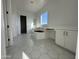 Bathroom featuring hexagonal tile flooring, soaking tub, and built-in vanity at 11447 E Utah Ave, Mesa, AZ 85212