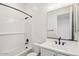 Clean bathroom with sink vanity, white cabinets, and a shower-tub combination with subway tile at 11447 E Utah Ave, Mesa, AZ 85212