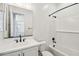 Bathroom with white vanity, black fixtures, and a tiled shower/tub combo at 11447 E Utah Ave, Mesa, AZ 85212