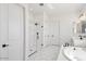 Elegant bathroom with a glass-enclosed shower and a soaking tub at 11447 E Utah Ave, Mesa, AZ 85212