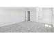 Large bedroom with neutral carpet, recessed lighting, and bright sunny windows at 11447 E Utah Ave, Mesa, AZ 85212