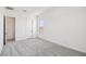 Bright bedroom with gray carpet and white walls, and natural light from a paned window at 11447 E Utah Ave, Mesa, AZ 85212