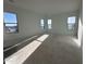 Spacious bedroom with natural light and large windows showcasing outdoor views at 11447 E Utah Ave, Mesa, AZ 85212