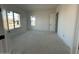 Sun-drenched room with large windows and neutral walls ready for customization at 11447 E Utah Ave, Mesa, AZ 85212