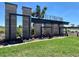 Landscaped community entrance with stone monuments and grid-like modern metal signage reading Destination at Gateway at 11447 E Utah Ave, Mesa, AZ 85212