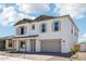 Two-story home featuring a two-car garage, neutral color scheme and minimal landscaping at 11447 E Utah Ave, Mesa, AZ 85212