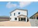 A bright white two-story home featuring a covered patio and a fenced in backyard ready for landscaping at 11447 E Utah Ave, Mesa, AZ 85212