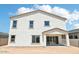This beautiful house features a crisp white exterior, a covered patio, and is bathed in natural light at 11447 E Utah Ave, Mesa, AZ 85212