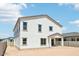 Exterior view of a bright white house with a covered patio and plenty of windows for ample natural light at 11447 E Utah Ave, Mesa, AZ 85212