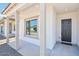 Covered front porch with stone pillars and a view of the front door at 11447 E Utah Ave, Mesa, AZ 85212