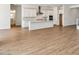 Open kitchen featuring white cabinets, stainless steel appliances, and a large island at 11447 E Utah Ave, Mesa, AZ 85212