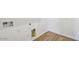 Bright utility room with wood-style tile flooring and modern hookups at 11447 E Utah Ave, Mesa, AZ 85212