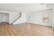 Spacious living room featuring hardwood flooring, recessed lighting, and a staircase at 11447 E Utah Ave, Mesa, AZ 85212