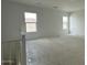 Unfinished loft with neutral paint, a staircase and two windows at 11447 E Utah Ave, Mesa, AZ 85212