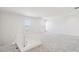 Bright loft space with neutral carpet, fresh white walls, and natural light from two well-placed windows at 11447 E Utah Ave, Mesa, AZ 85212