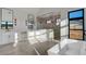 Bright bathroom with a soaking tub and frameless glass shower, dual sinks, and modern fixtures at 11841 N 65Th Pl, Scottsdale, AZ 85254