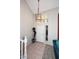 Welcoming entryway with tiled flooring, coat rack, and modern pendant lighting at 1227 E Sheena Dr, Phoenix, AZ 85022