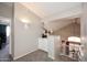 Upper hallway area with cabinet, sconce, and view into the living room at 1227 E Sheena Dr, Phoenix, AZ 85022